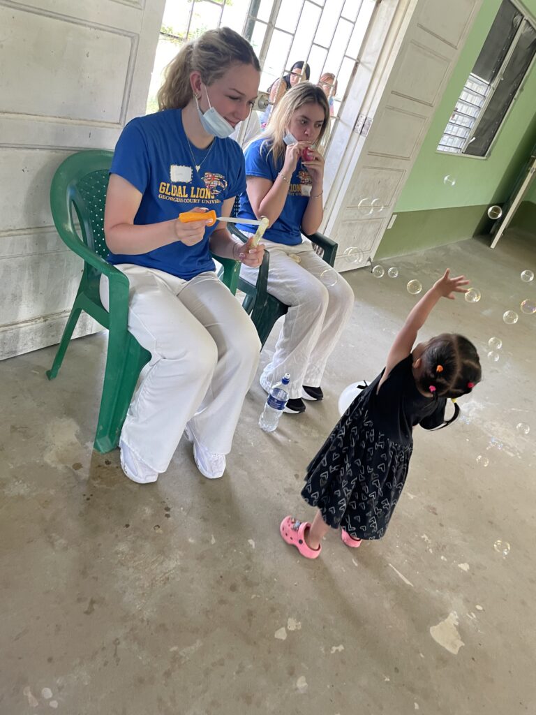Cute kid playing with the bubbles
